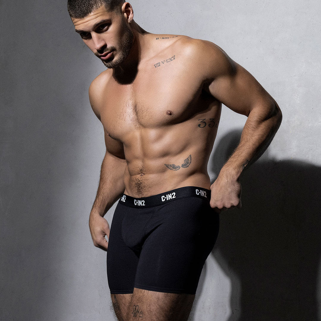 Man wearing black underwear with C-IN2 brand with a gray background