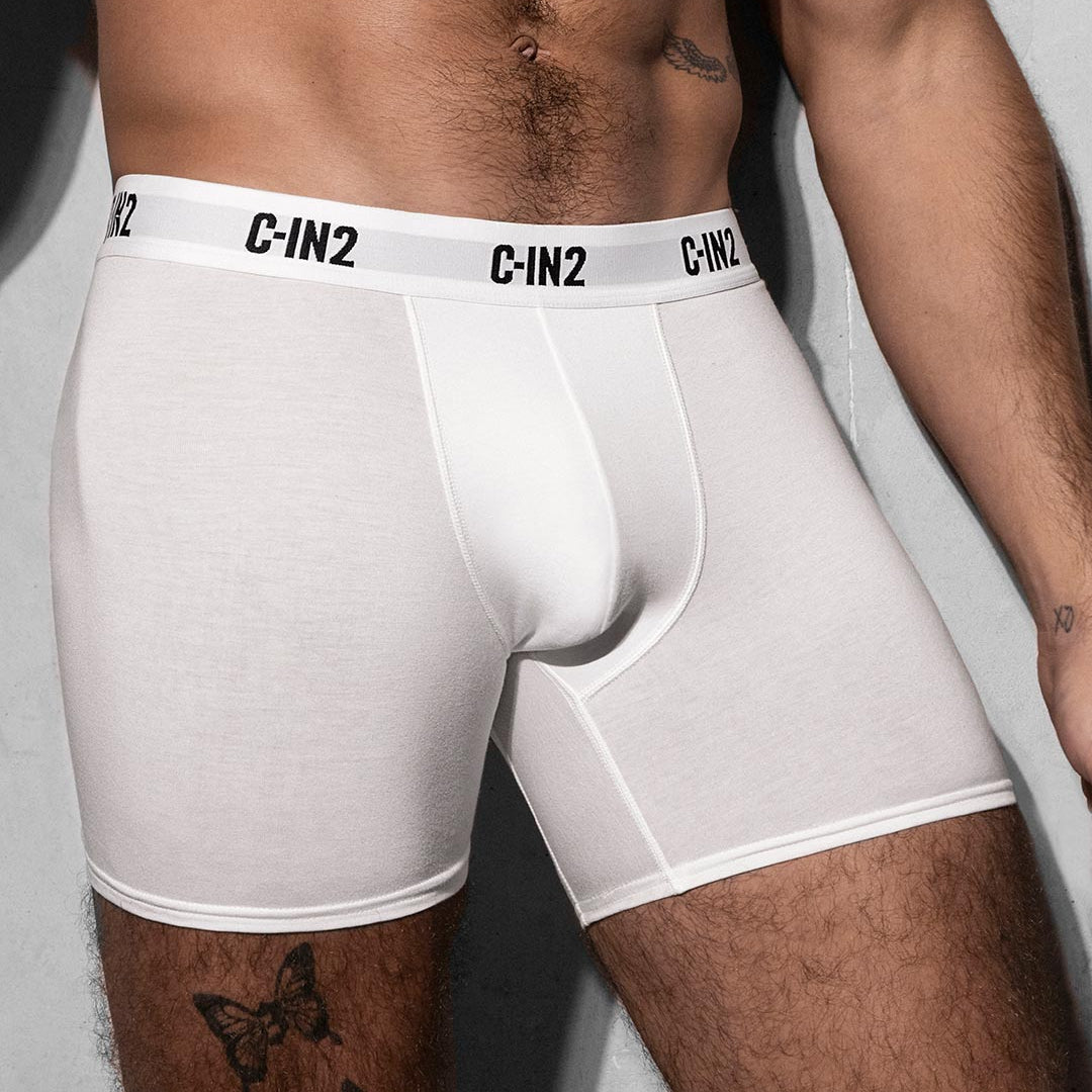 White boxer briefs with a C-IN2 brand logo on a neutral background