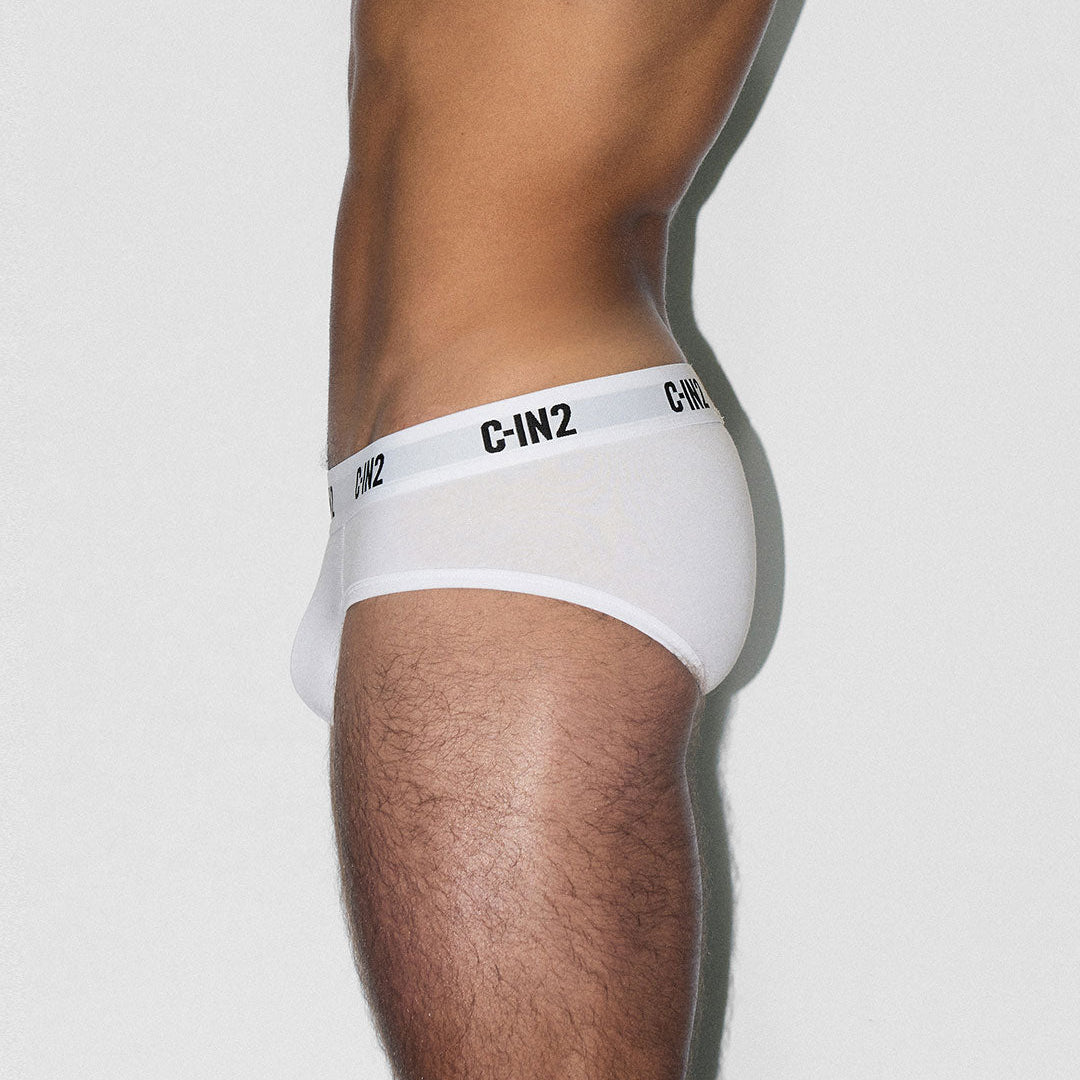 White underwear with 'C-IN2' brand logo on a light gray background