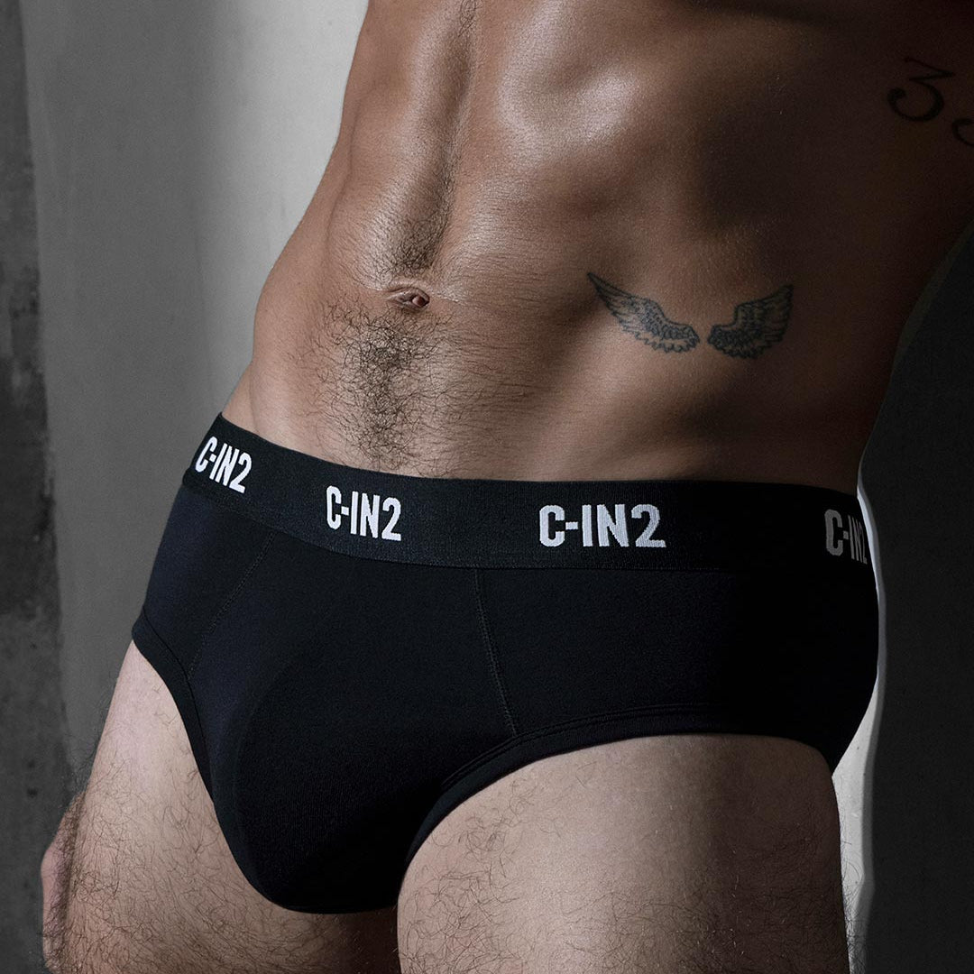 Black men's underwear with 'C-IN2' branding on a gray background