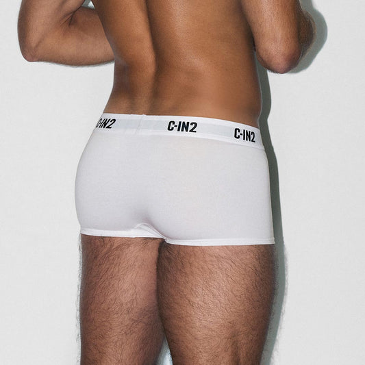 Person wearing white underwear with 'C-IN2' brand label on a plain background
