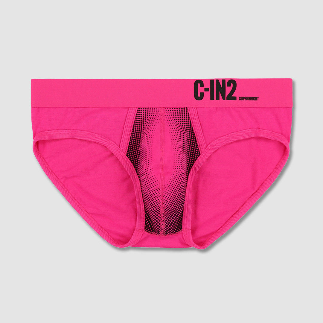 Bright pink men's briefs with a black mesh center panel and black 'C-IN2' branding on the waistband, shown flat against a light gray background.