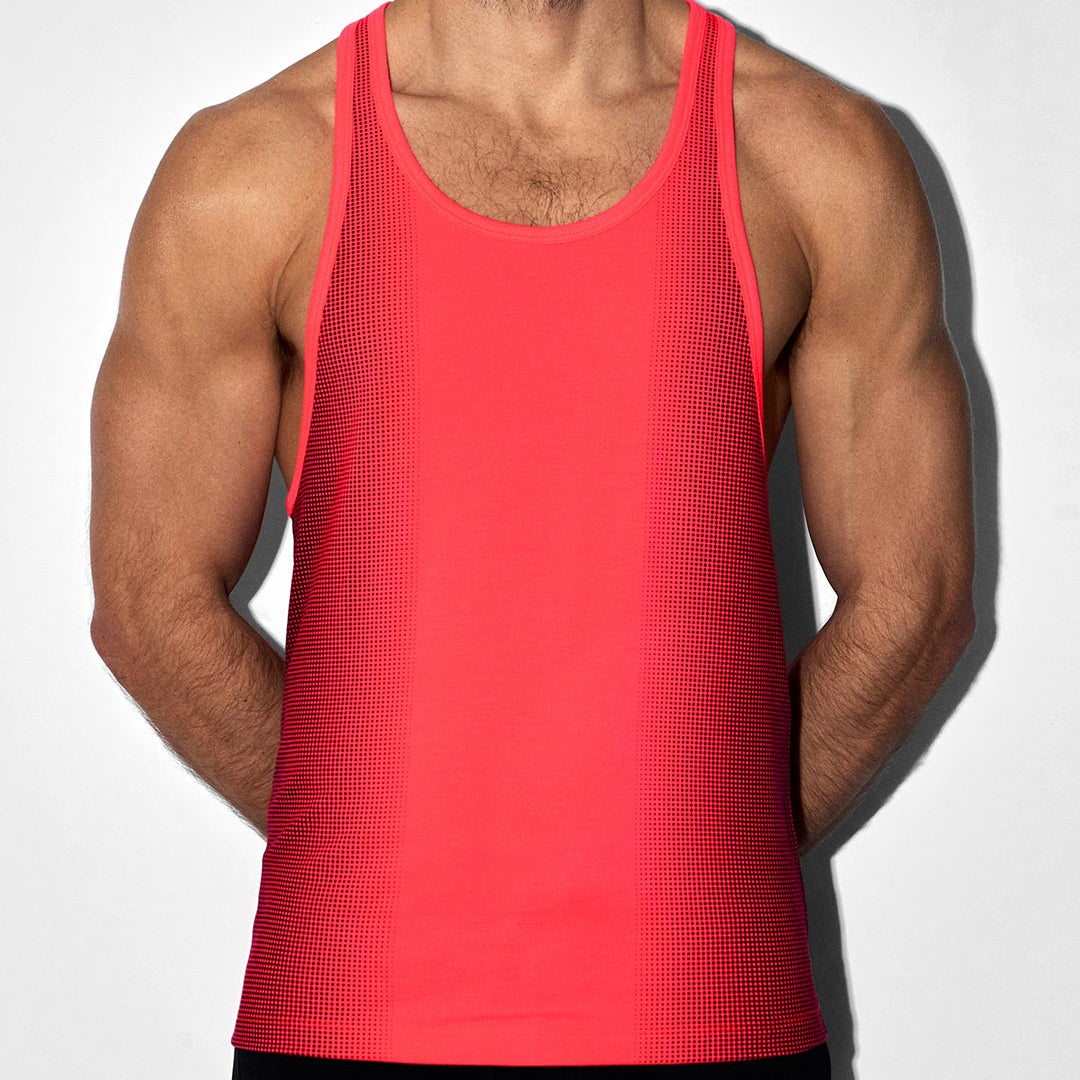 Person wearing a red tank top against a white background
