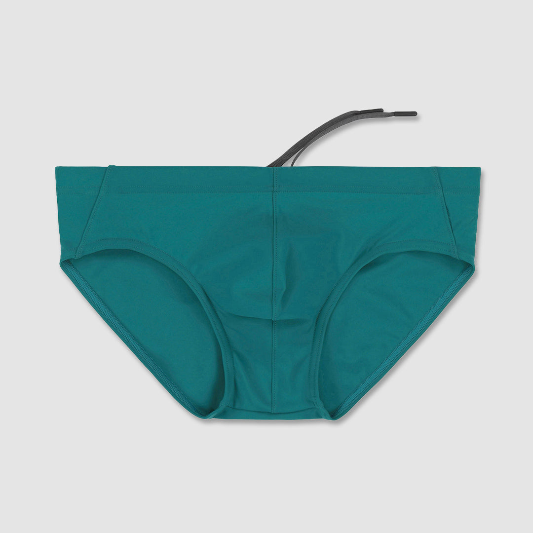 Teal bikini speedo bottom with a strap on a light gray background