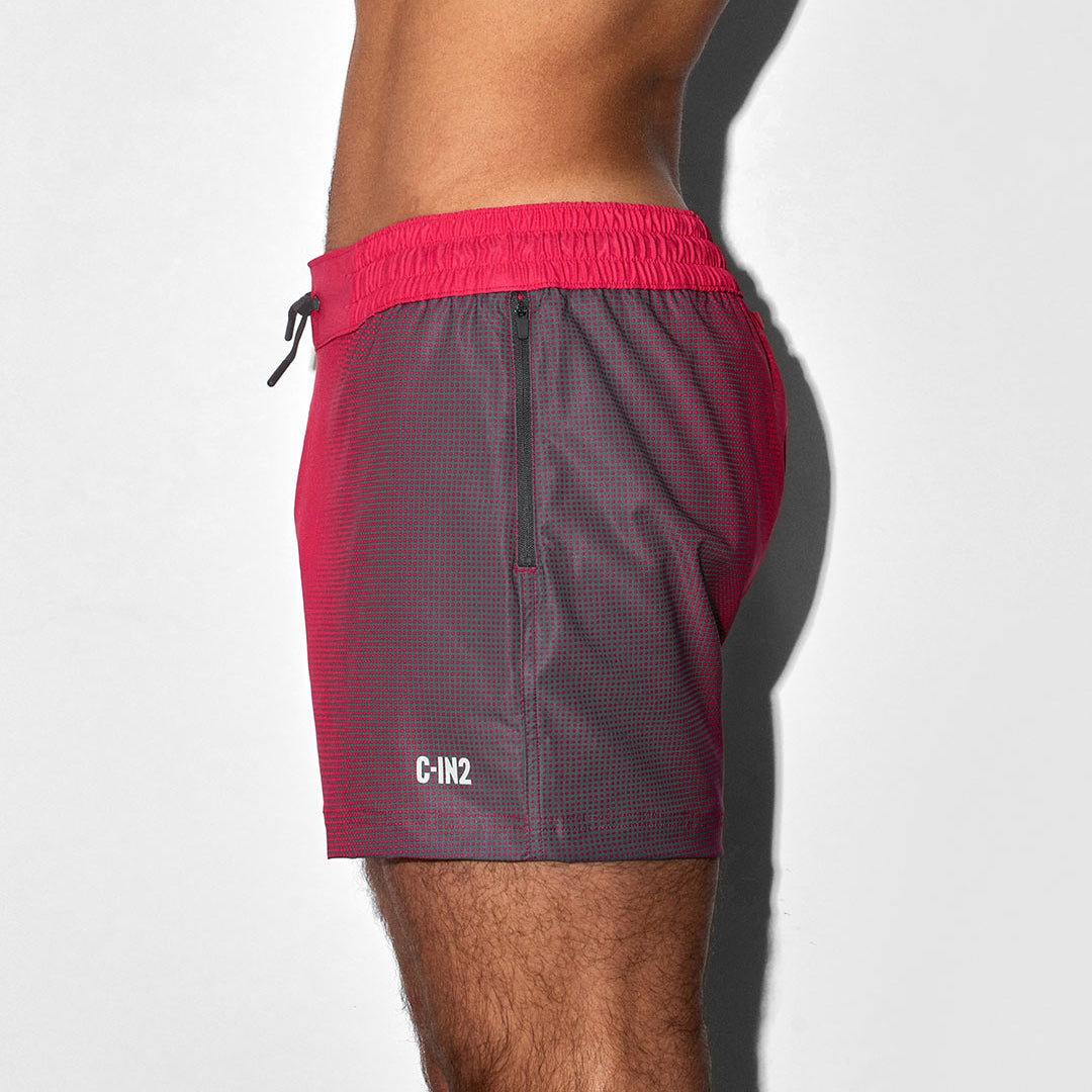 Red and gray shorts with a 'C-IN2' brand logo on a white background