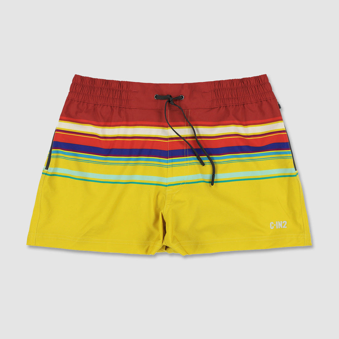 Colorful striped swim shorts with C-IN2 logo on a light gray background