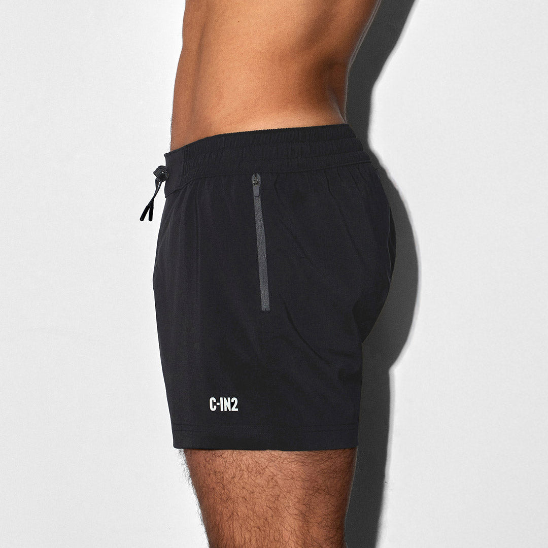 Black athletic shorts with a 'C-IN2' brand logo on a white background