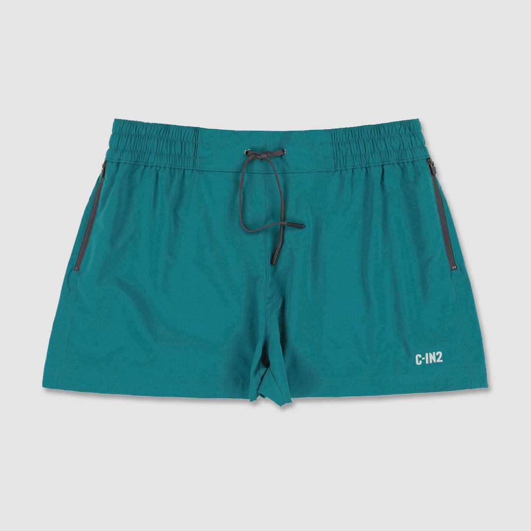 Teal trunks with a drawstring and 'C-IN2' brand logo on a light gray background