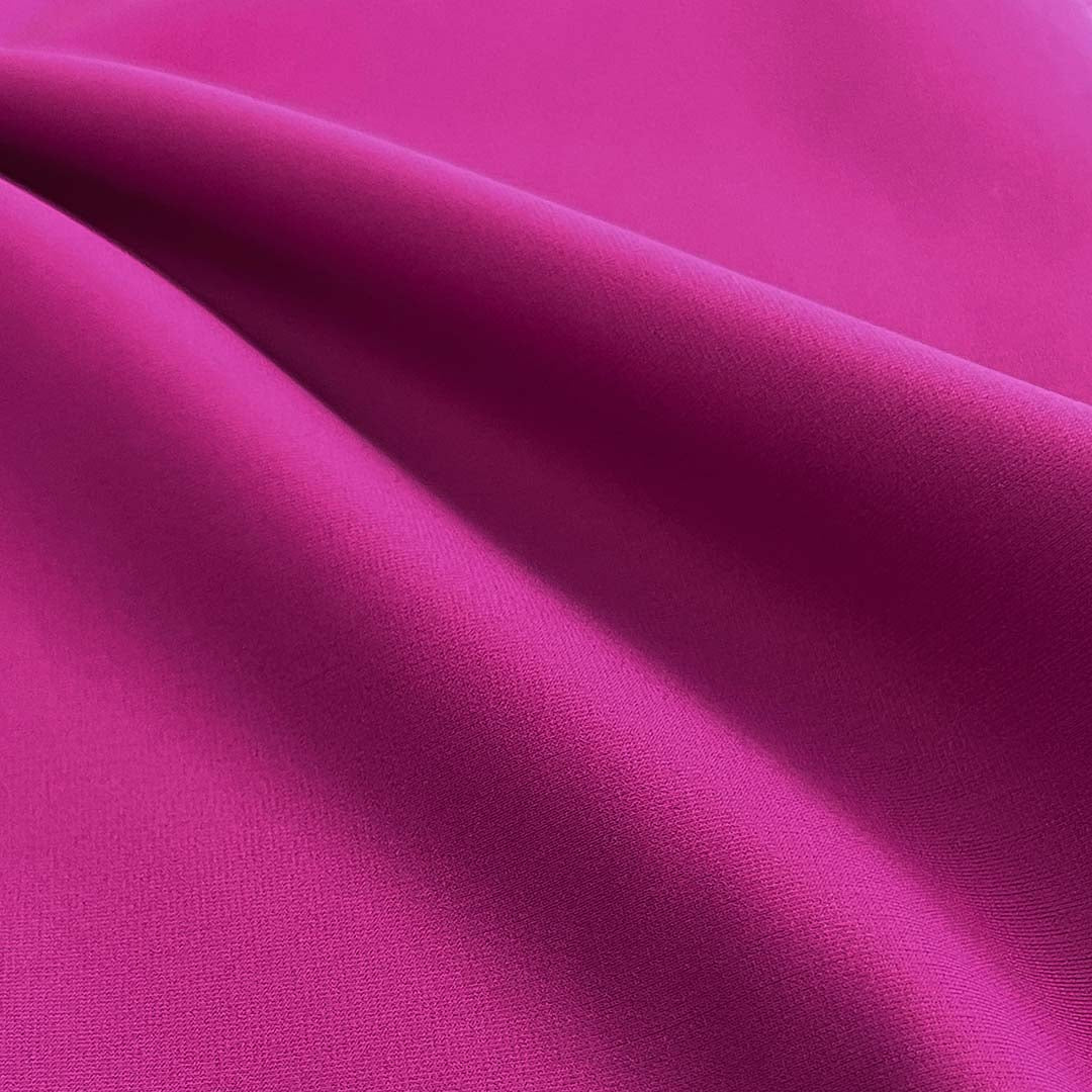 Close-up of pink fabric with folds