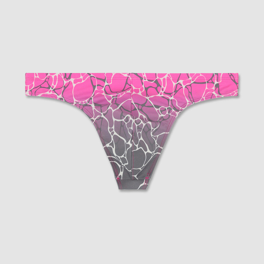 Pink and gray patterned swim thong on a light gray background