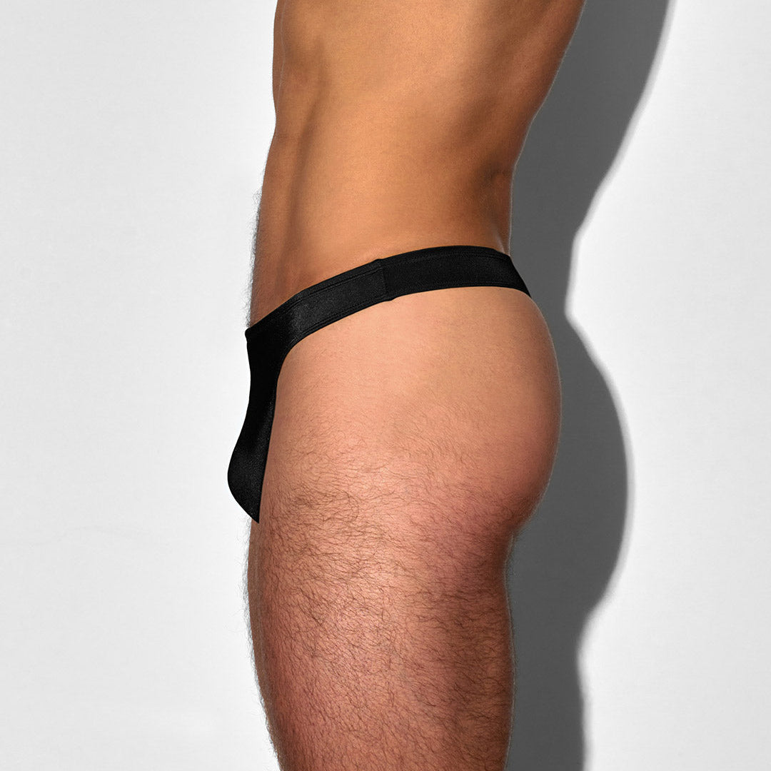 side angle of black men's swim thong on a white background