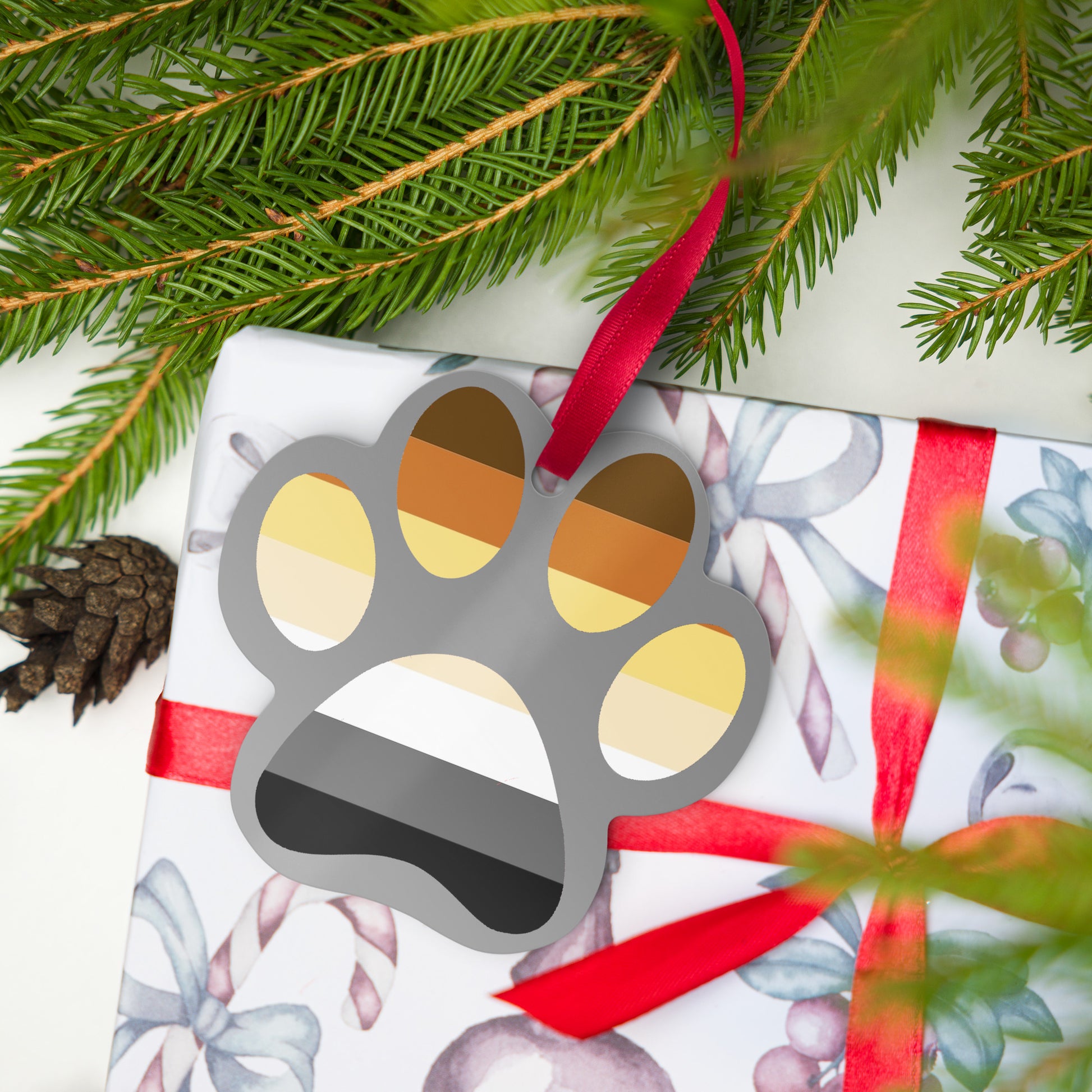 Gay Bear Paw Holiday Metal Ornament christmas_ornament_with_red_string_on_gift