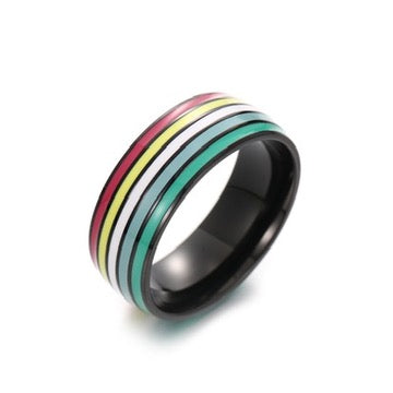Ring with black band and colorful disability pride stripes on a white background