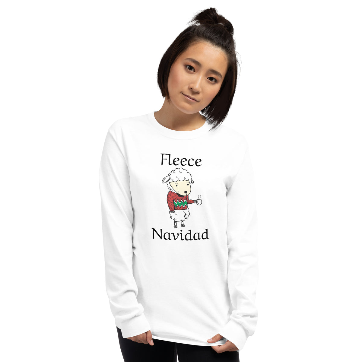 person wearing a white long sleeve tee shirt with cute sheep wearing a holiday sweater, holding a cup of coffee and black text that reads 'Fleece Navidad'