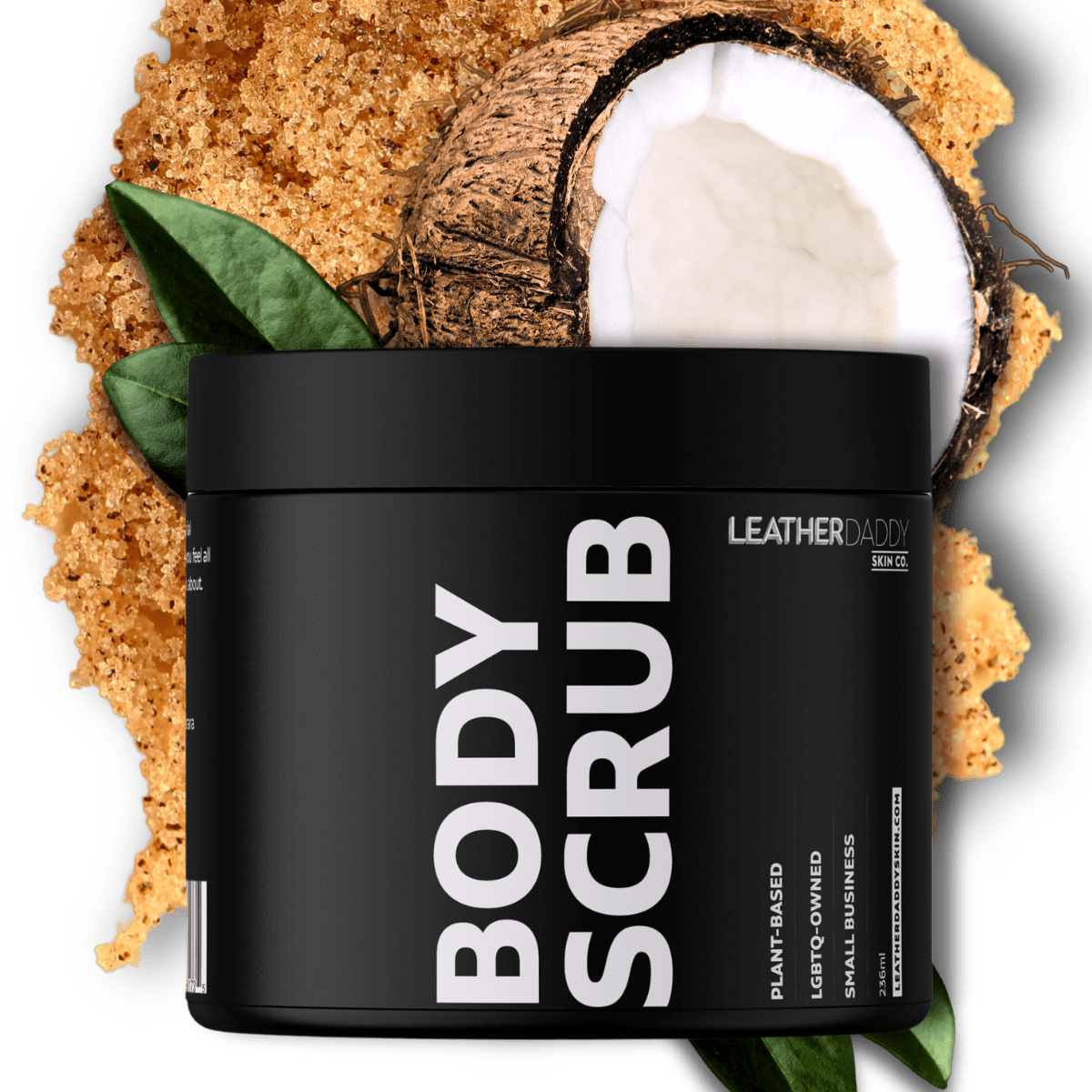 black jar of body scrub with white lettering of body scrub and leather daddy brand with coconut behind package