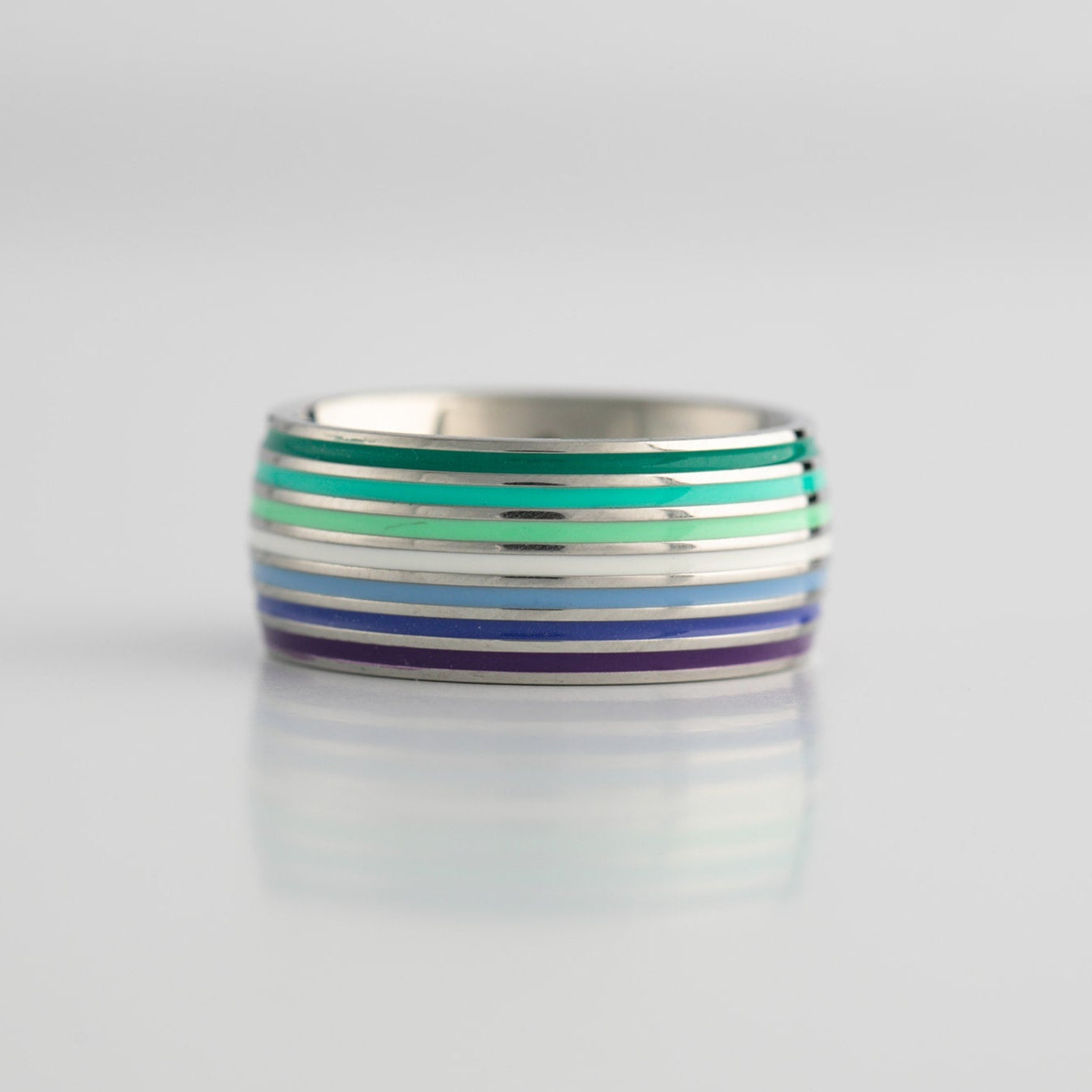 Gay MLM pride striped ring on a light gray background