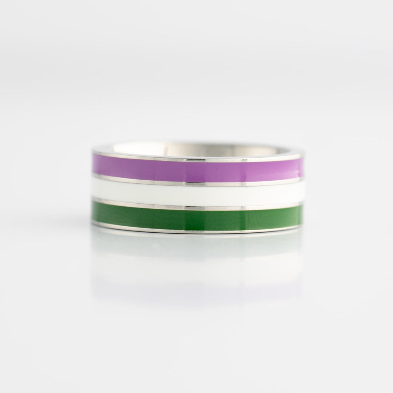 Ring with genderqueer pride flag stripes on a white background