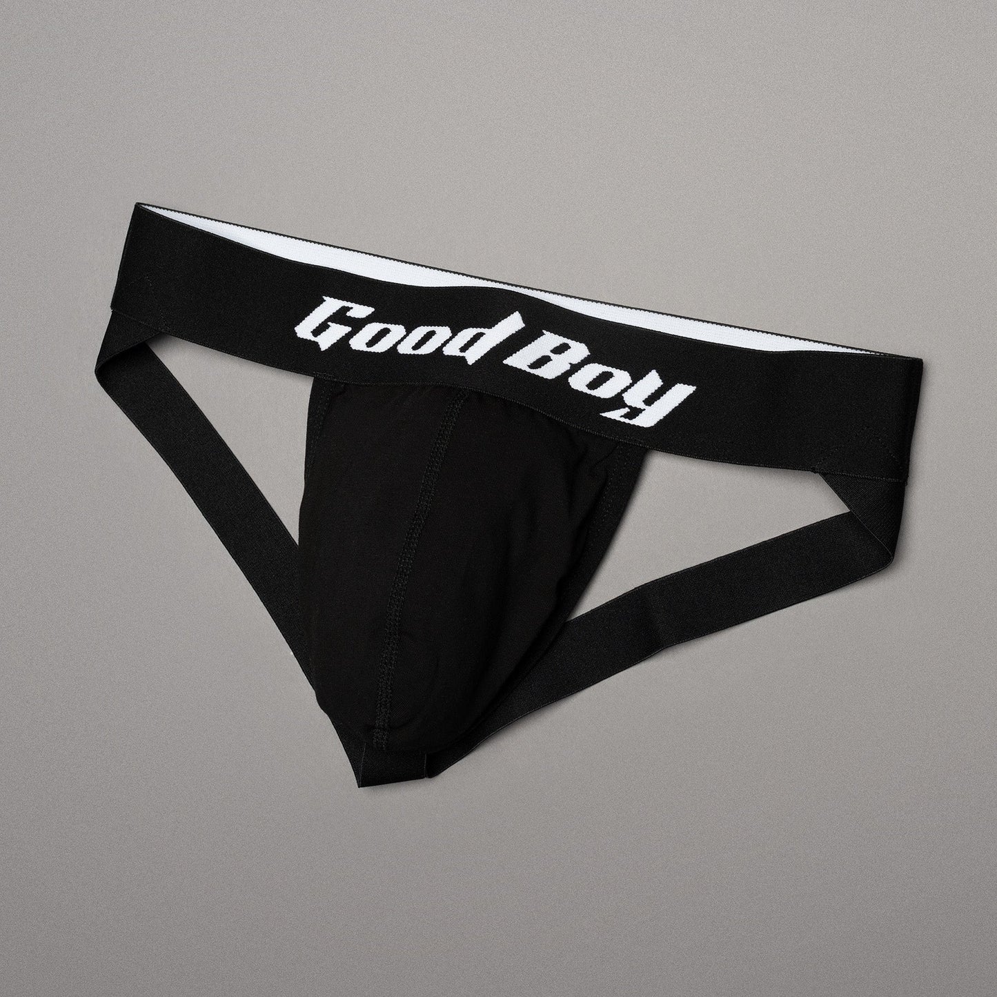 Black men's underwear with 'Good Boy' logo on a gray background