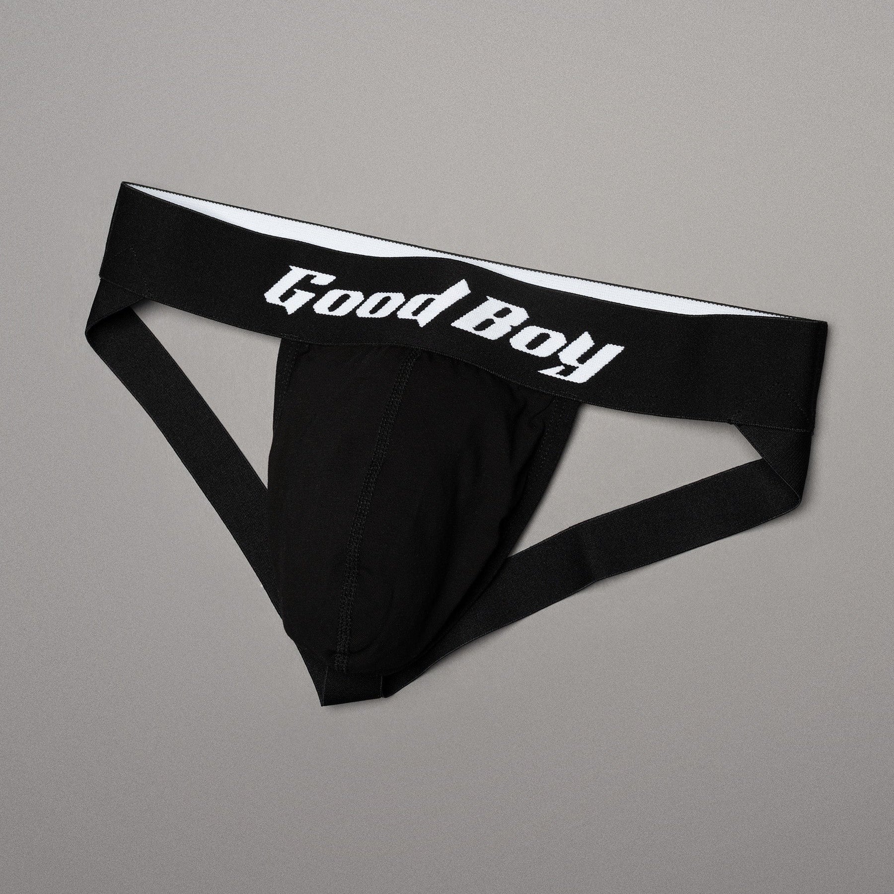 Black men's underwear with 'Good Boy' logo on a gray background