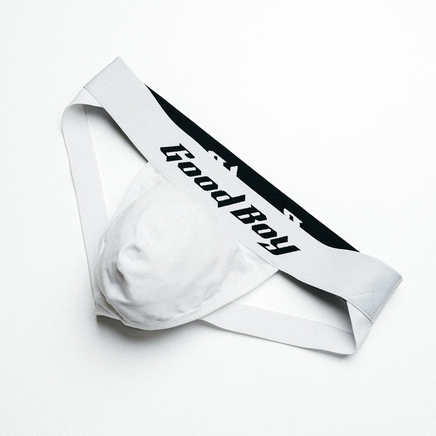 White jock strap with black 'Good Boy' logo on a white background