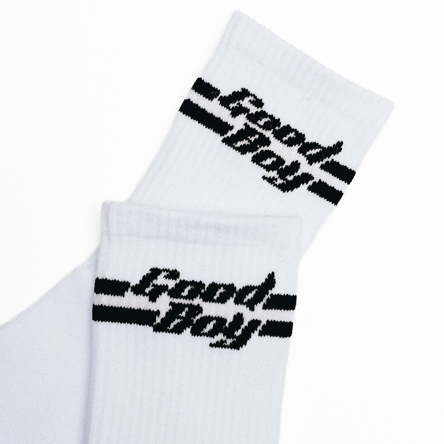 White socks with black 'Good Boy' text in black on a white background