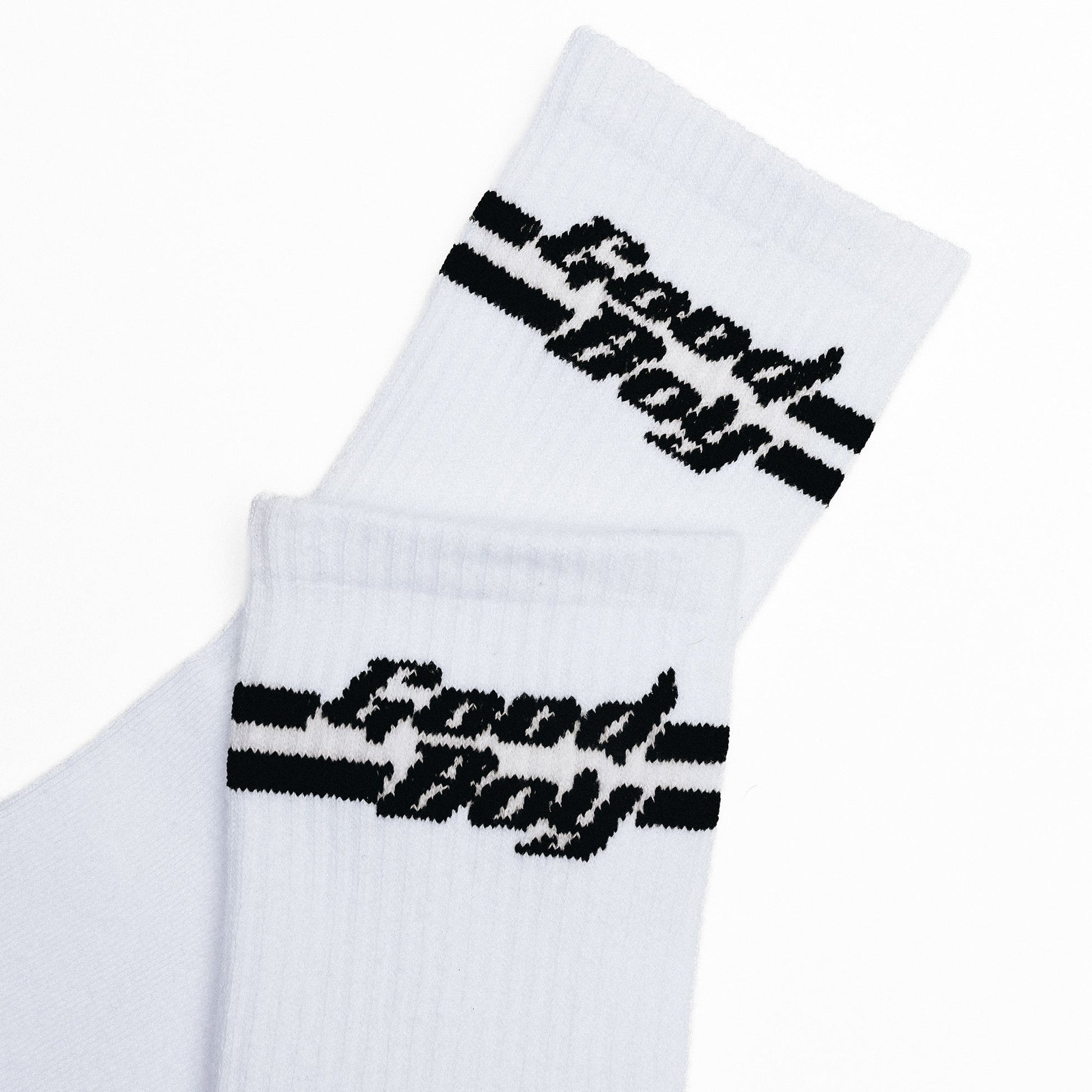 White socks with black 'Good Boy' text in black on a white background
