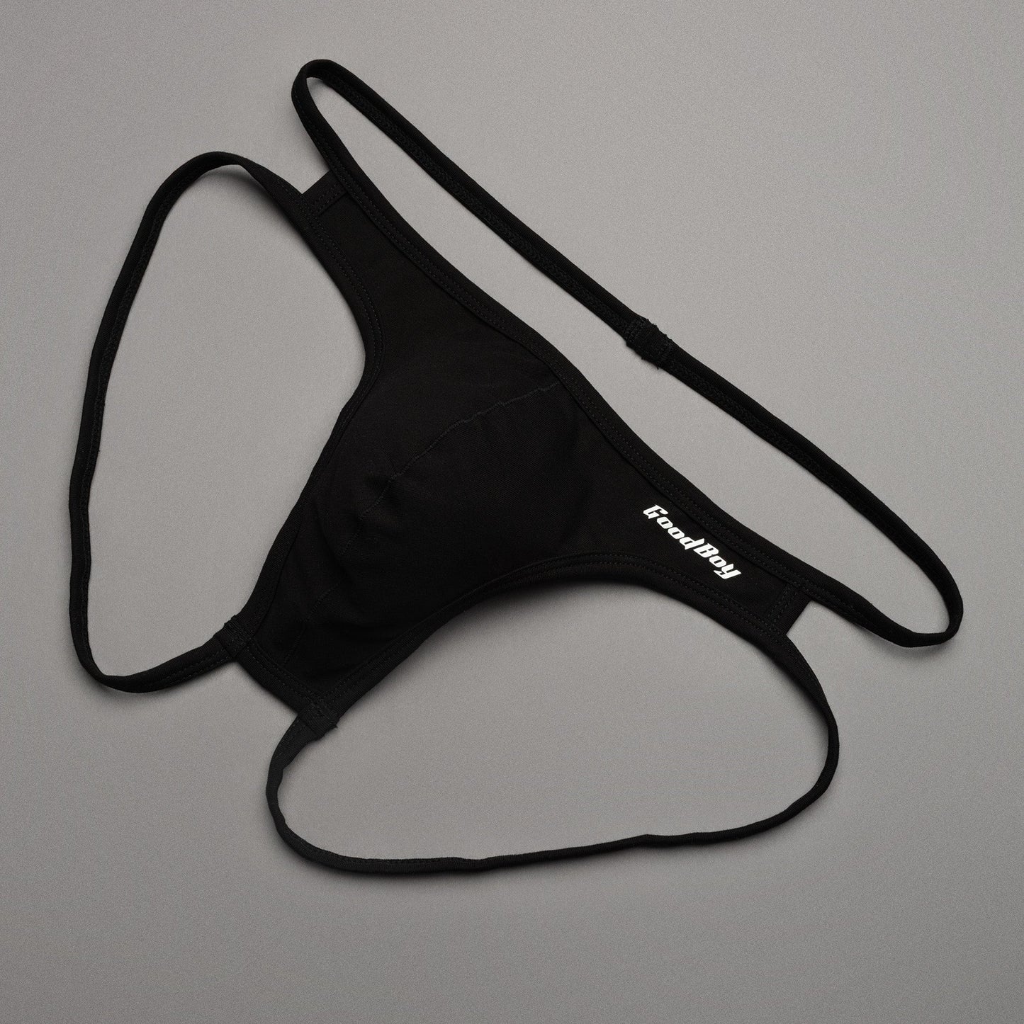Black men's underwear with 'Good Boy' brand logo on a gray background