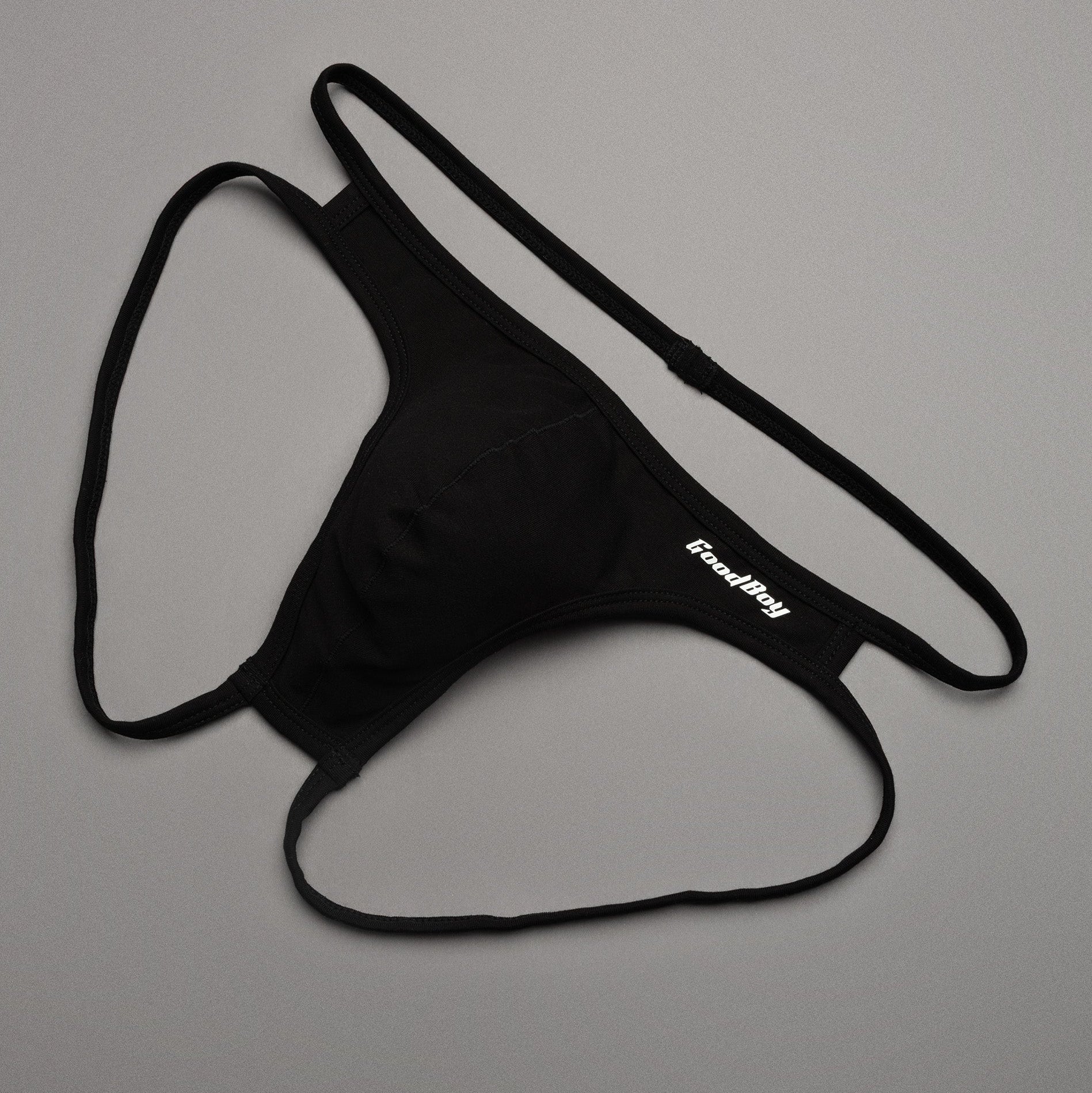 Black men's underwear with 'Good Boy' brand logo on a gray background