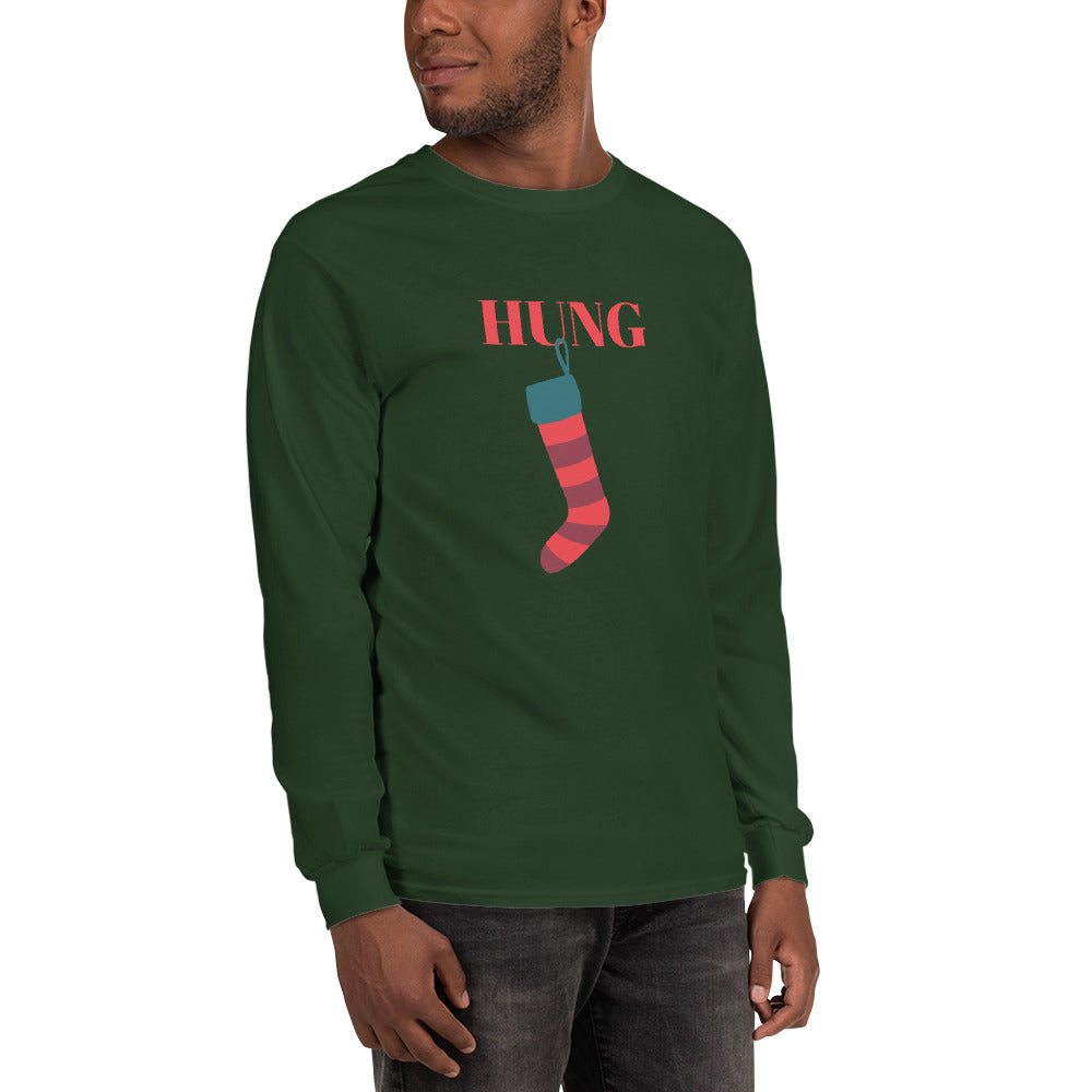 person wearing a green long sleeve shirt with red text that reads 'hung' with a holiday stocking hanging from the letter 'U'