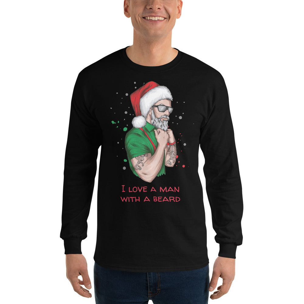 person wearing a black long sleeve shirt with an image of a lumbersexual style santa wearing a green shirt, red suspenders, traditional santa hat, sunglasses, tattoos, and dark sunglasses and text in red that reads ' i love a man with a beard'