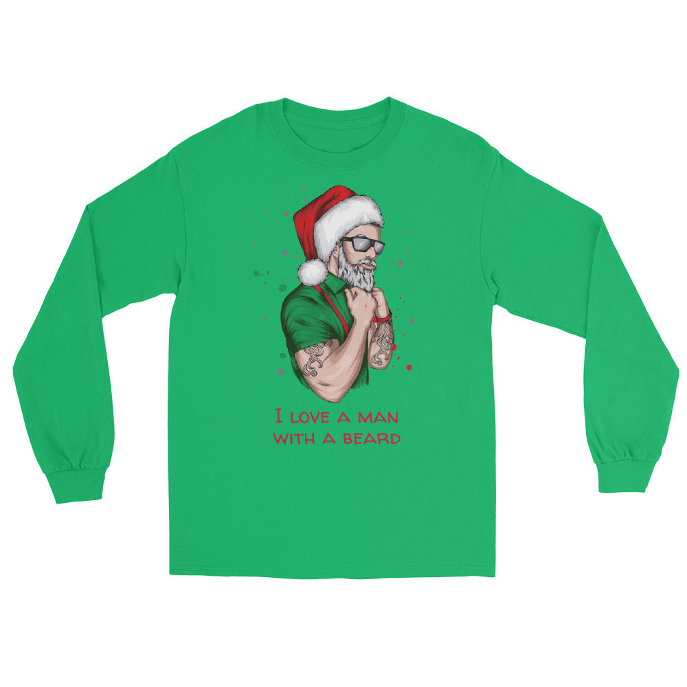 Green long sleeve shirt with an image of a lumbersexual style santa wearing a green shirt, red suspenders, traditional santa hat, sunglasses, tattoos, and dark sunglasses and text in red that reads ' i love a man with a beard'