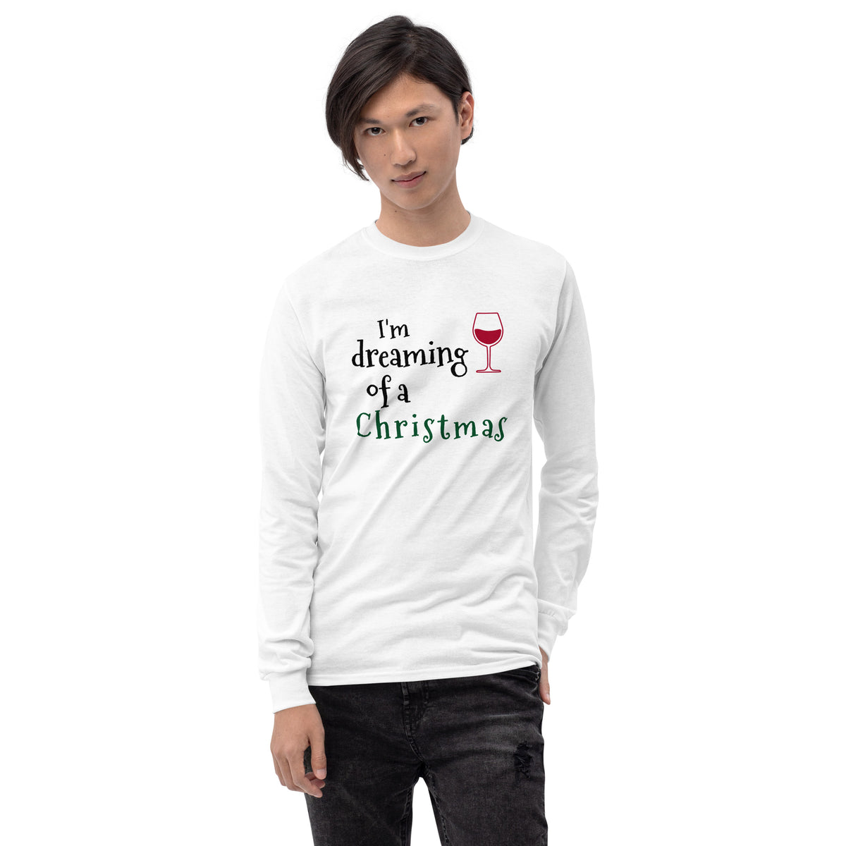 person wearing a white long sleeve tee shirt with a red wine glass and text that reads 'I'm dreaming of a wine Christmas' in black, white, and green letters