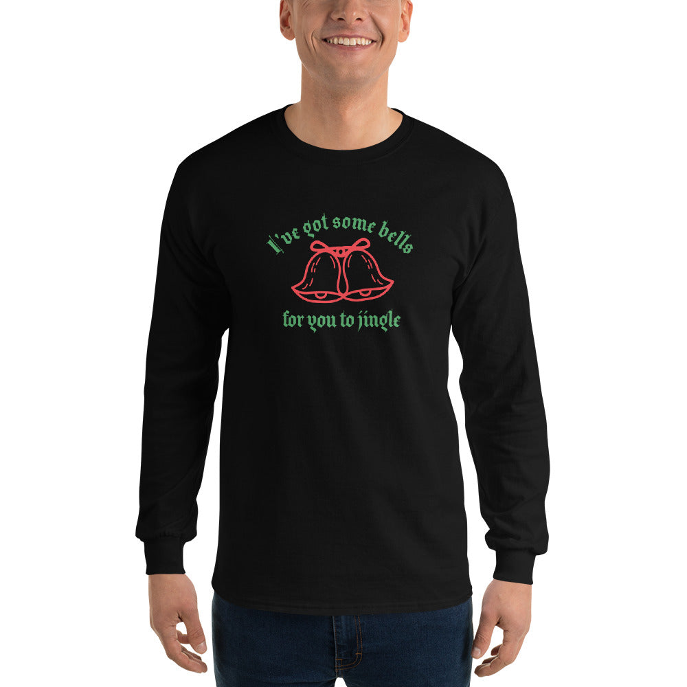 person wearing a black long sleeve shirt with green text that reads 'I've got some bells for you to jingle' and two red bells with bows