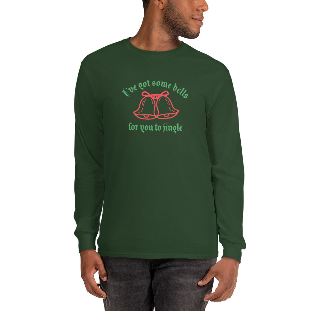 person wearing a dark green long sleeve shirt with green text that reads 'I've got some bells for you to jingle' and two red bells with bows