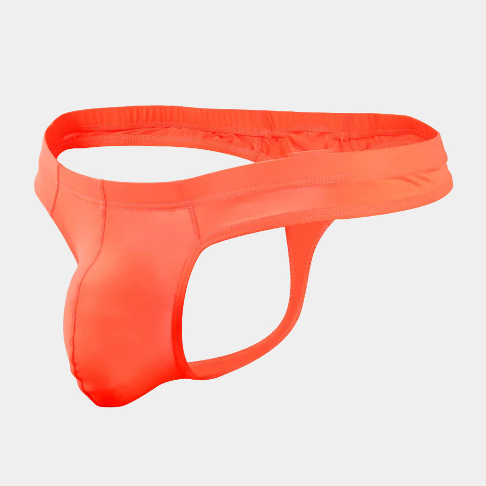 Neon orange men's underwear on a light gray background