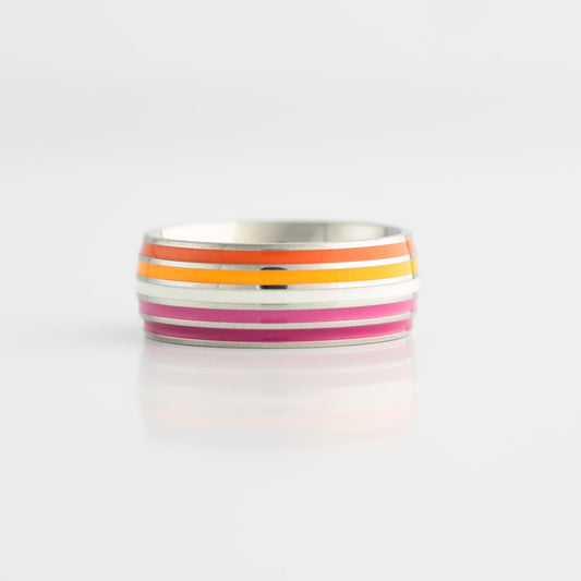 Ring with colorful lesbian pride stripes on a white background