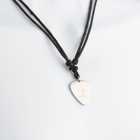 Necklace with a guitar pick shaped pendant on a light gray background