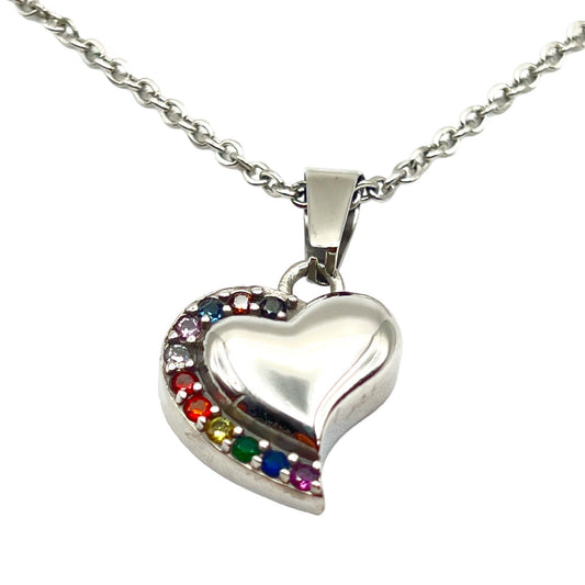 Silver heart-shaped pendant with colorful stones on a white background