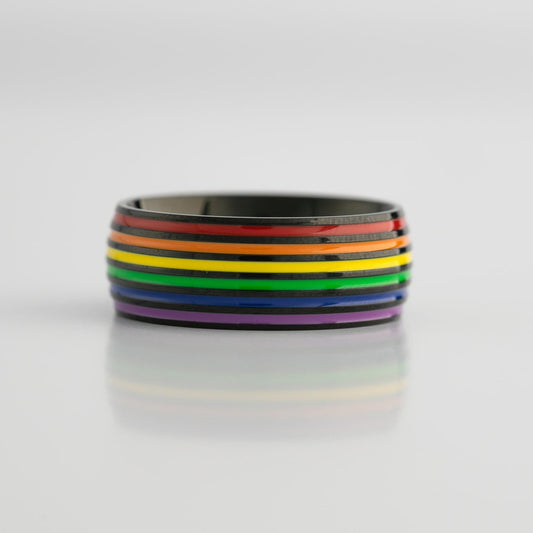 Black ring with lgbtq pride rainbow stripes on a white background