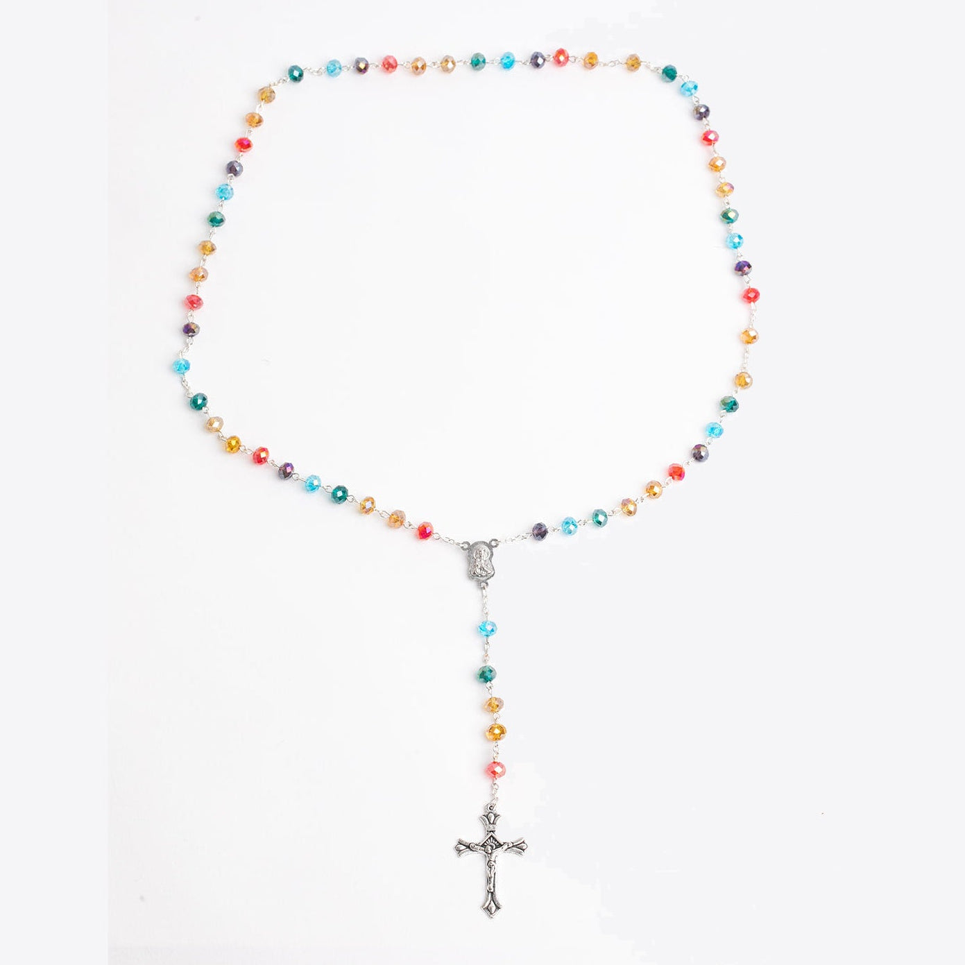 Rainbow beaded rosary with silver cross on a white background