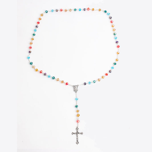 Rainbow beaded rosary with silver cross on a white background