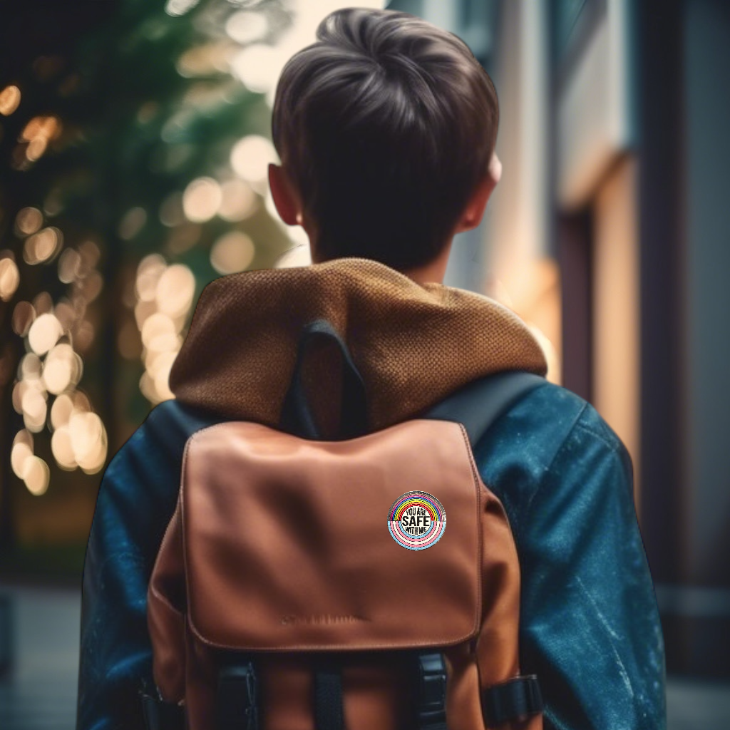 Student carrying a brown backpack with a rainbow lapel pin on it that says "you are safe with me'