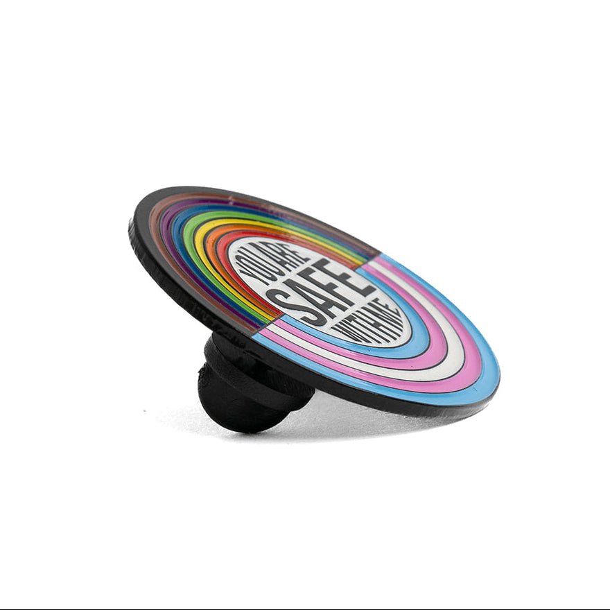 Colorful lapel pin with a black base on a white background