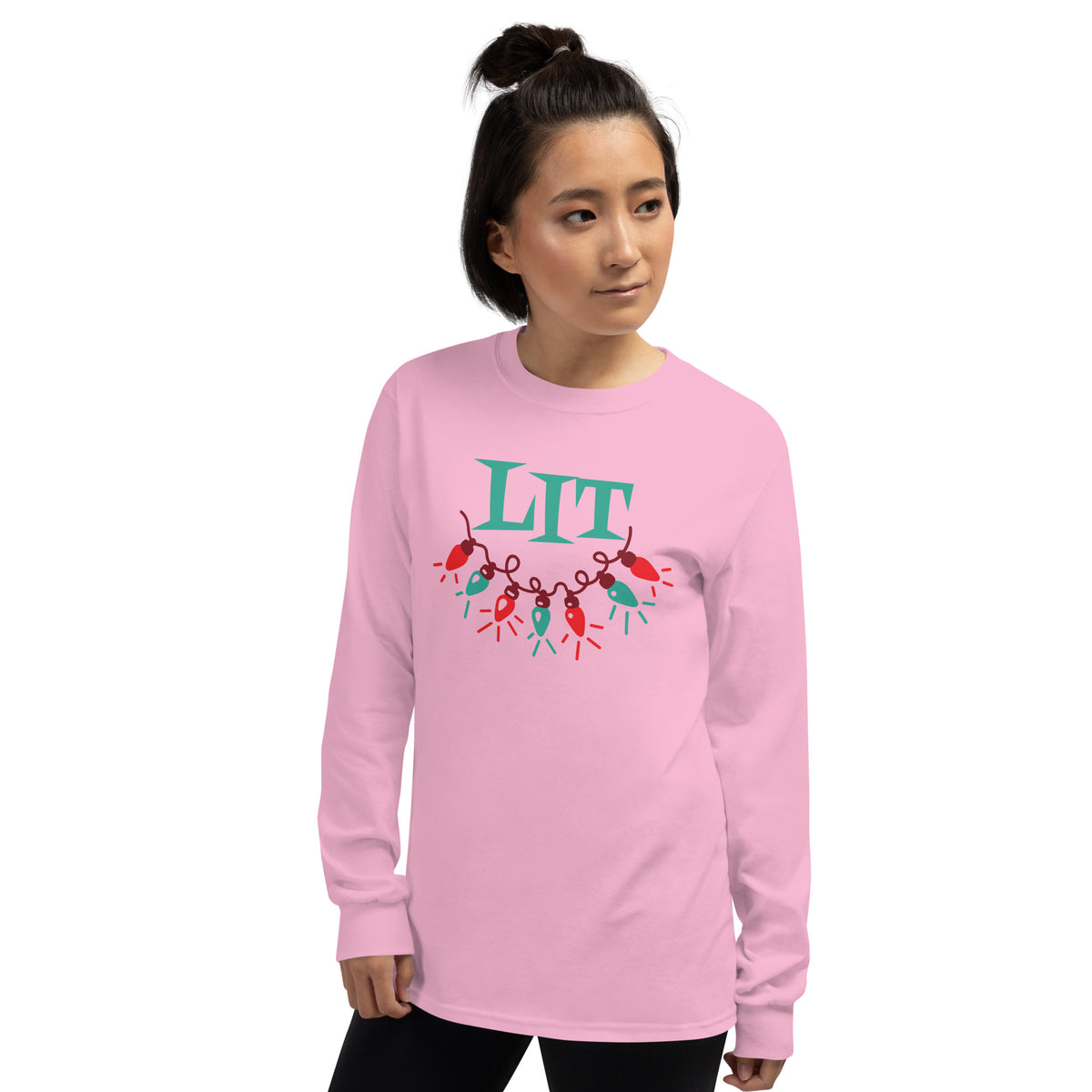 person wearing a pink long sleeve tee shirt with a string of red and green holiday lights and green text that reads 'LIT'