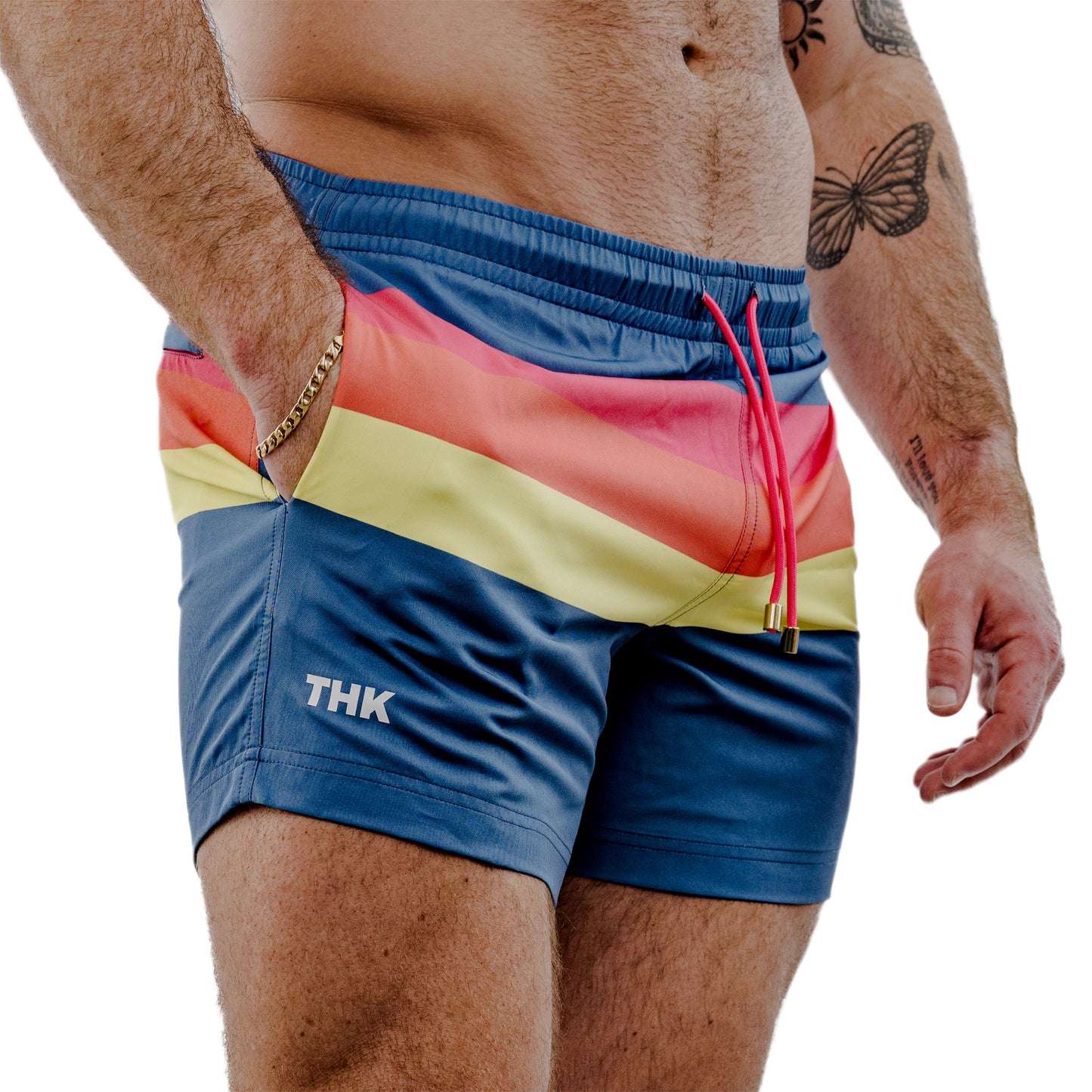 Multicolored swim shorts with 'THK' branding on a white background