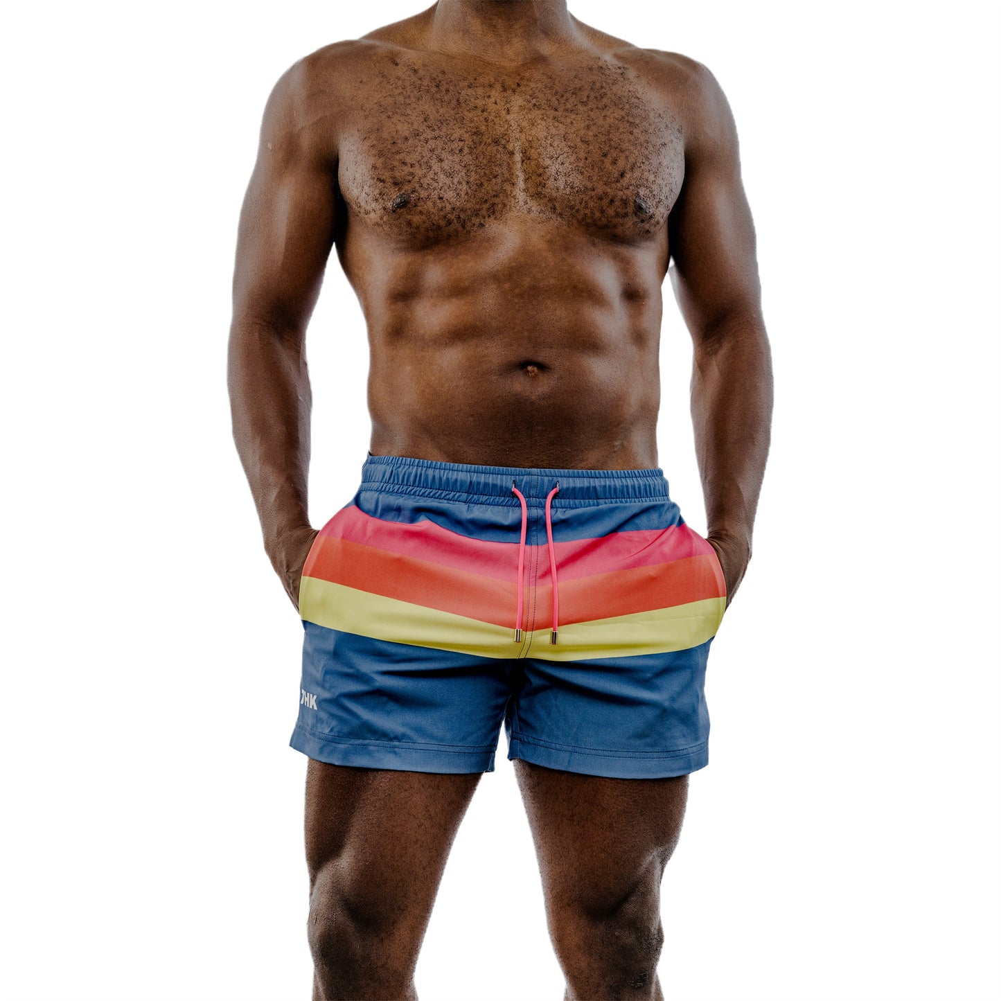 Man wearing colorful striped swim shorts on a white background