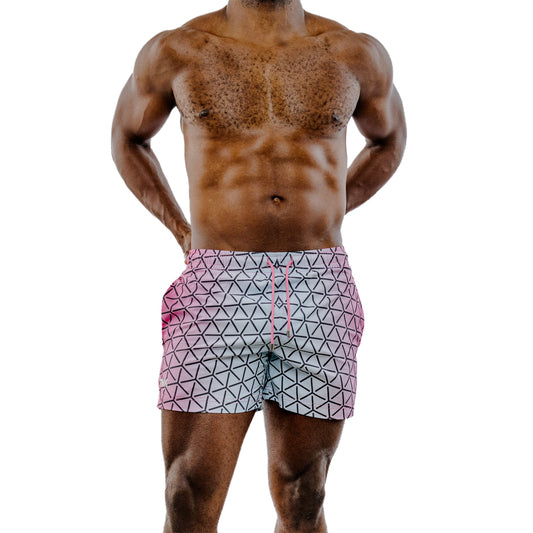 Man wearing geometric patterned shorts on a white background