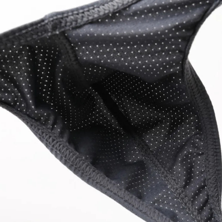 Black textured fabric on a white background