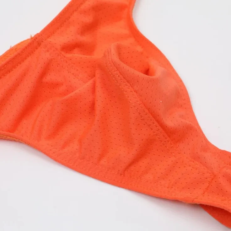 Orange bikini bottom on a white background