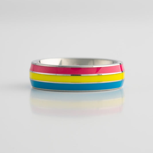 Ring with pansexual pride stripes on a white background